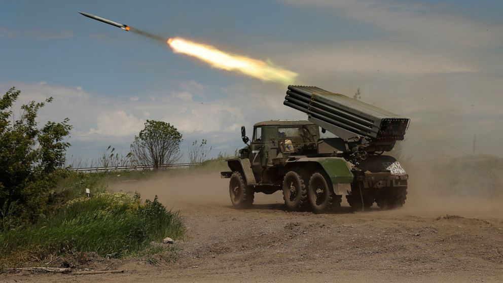 A Donetsk People's Republic militia's multiple rocket launcher fires from its position not far from Panteleimonivka, in territory under the government of the Donetsk People's Republic, eastern Ukraine, Saturday, May 28, 2022. (AP Photo/Alexei Alexandrov)