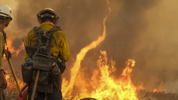 Coastal storm cools California heat wave, dampens southern wildfire