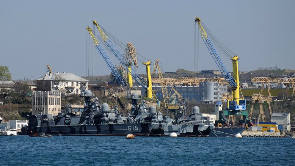 FILE - Russian Black Sea fleet ships are anchored in one of the bays of Sevastopol, Crimea, March 31, 2014. On Saturday, Oct. 29, 2022 at least two Russian ships suffered damage in a major port in Crimea, the Ukrainian peninsula annexed by Moscow in