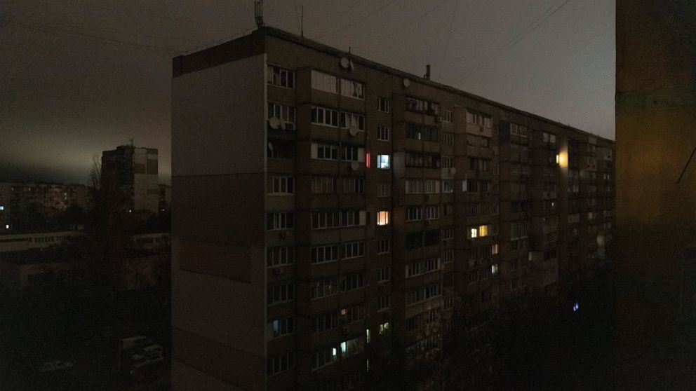 Windows of an apartment building are illuminated during a blackout in central Kyiv, Ukraine, Monday, Nov. 14, 2022. (AP Photo/Andrew Kravchenko)
